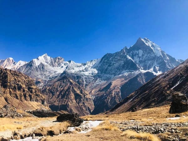 Machapuchare The Sacred Fishtail Fountain Partially Veiled In Clouds During The Annapurna Base Camp Trek