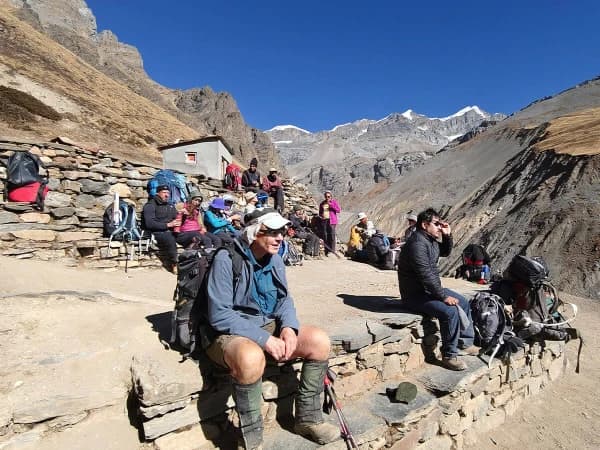 Outdoor Seating Area Of A Teahouse With Panoramic Mountain Views Trekkers Are Enjoying