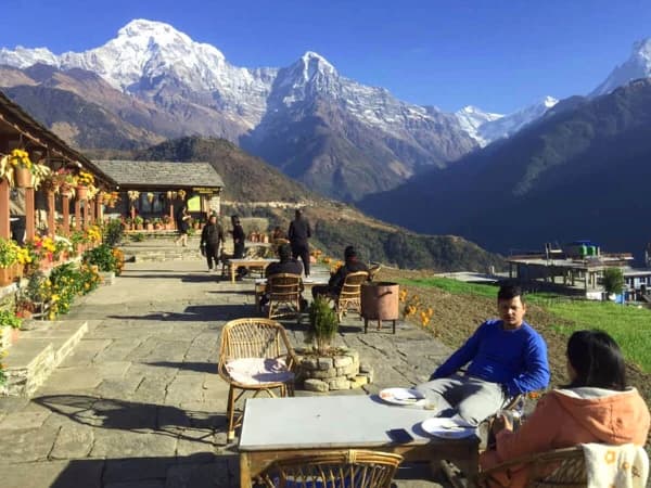 Trekkers Resting At A Teahouse Along The Annapurna Base Camp Trail